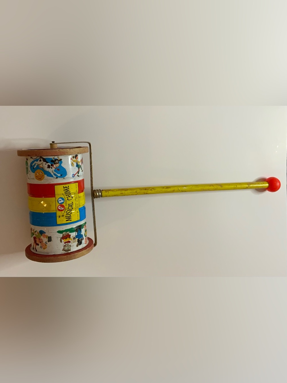 Vintage 50s Fisher-Price Musical Chime Toy with Red and Blue Accents